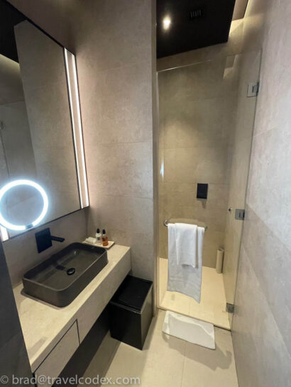 a bathroom with a mirror and sink