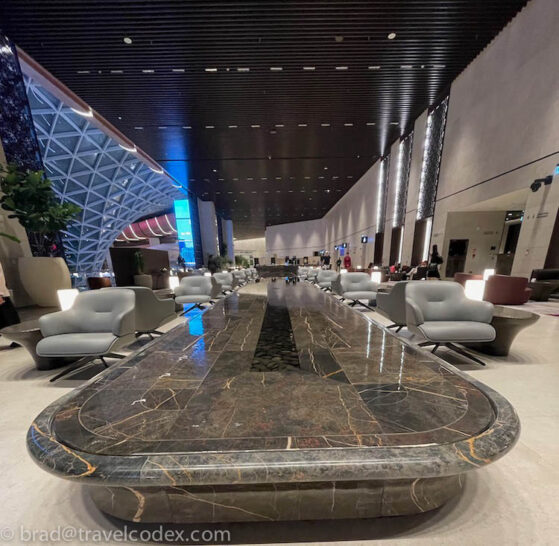 a large marble table in a lobby
