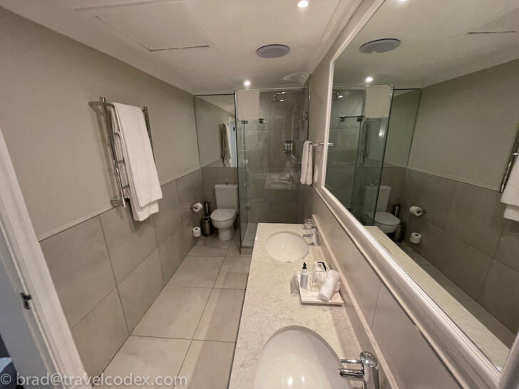 a bathroom with a mirror and sink