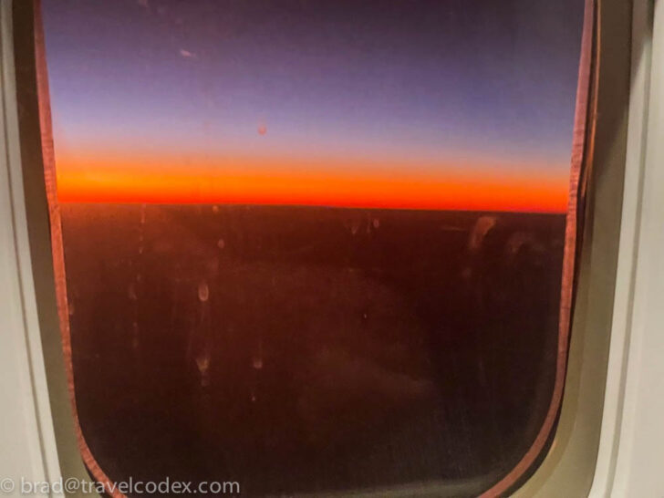 a sunset seen through a window