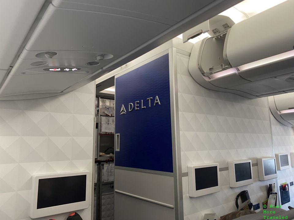 Delta Premium Select - front cabin Delta sign