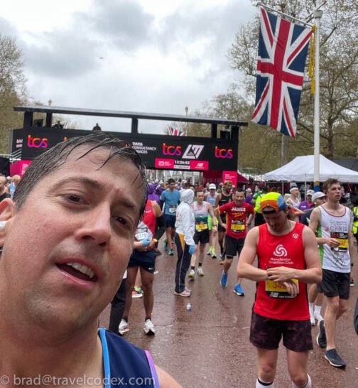 a man taking a selfie in front of a crowd of people