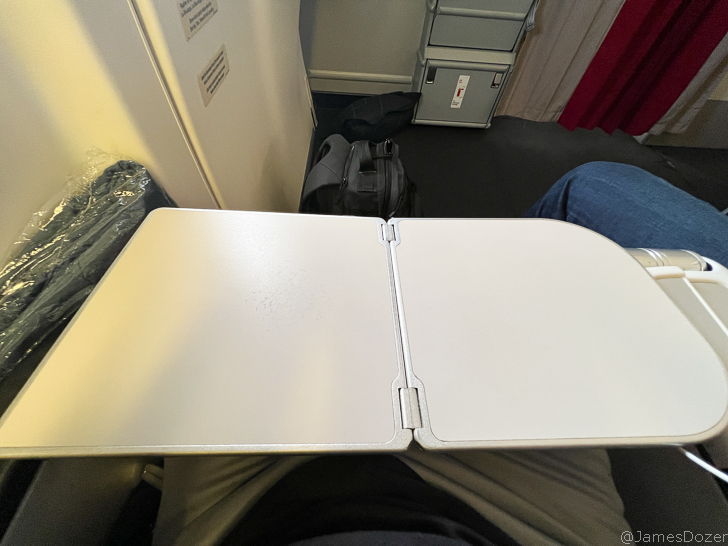 a white book on a person's lap