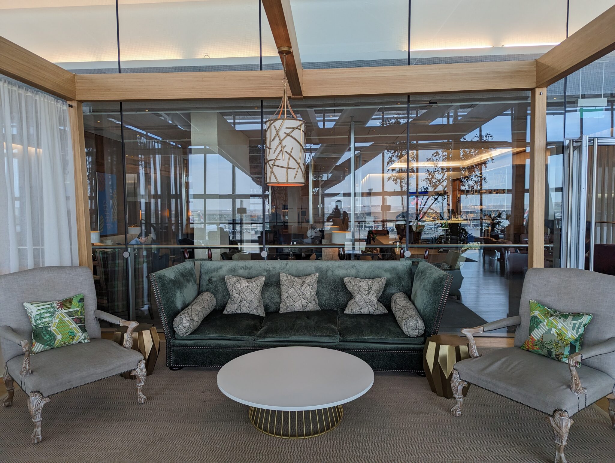 a room with a couch and chairs