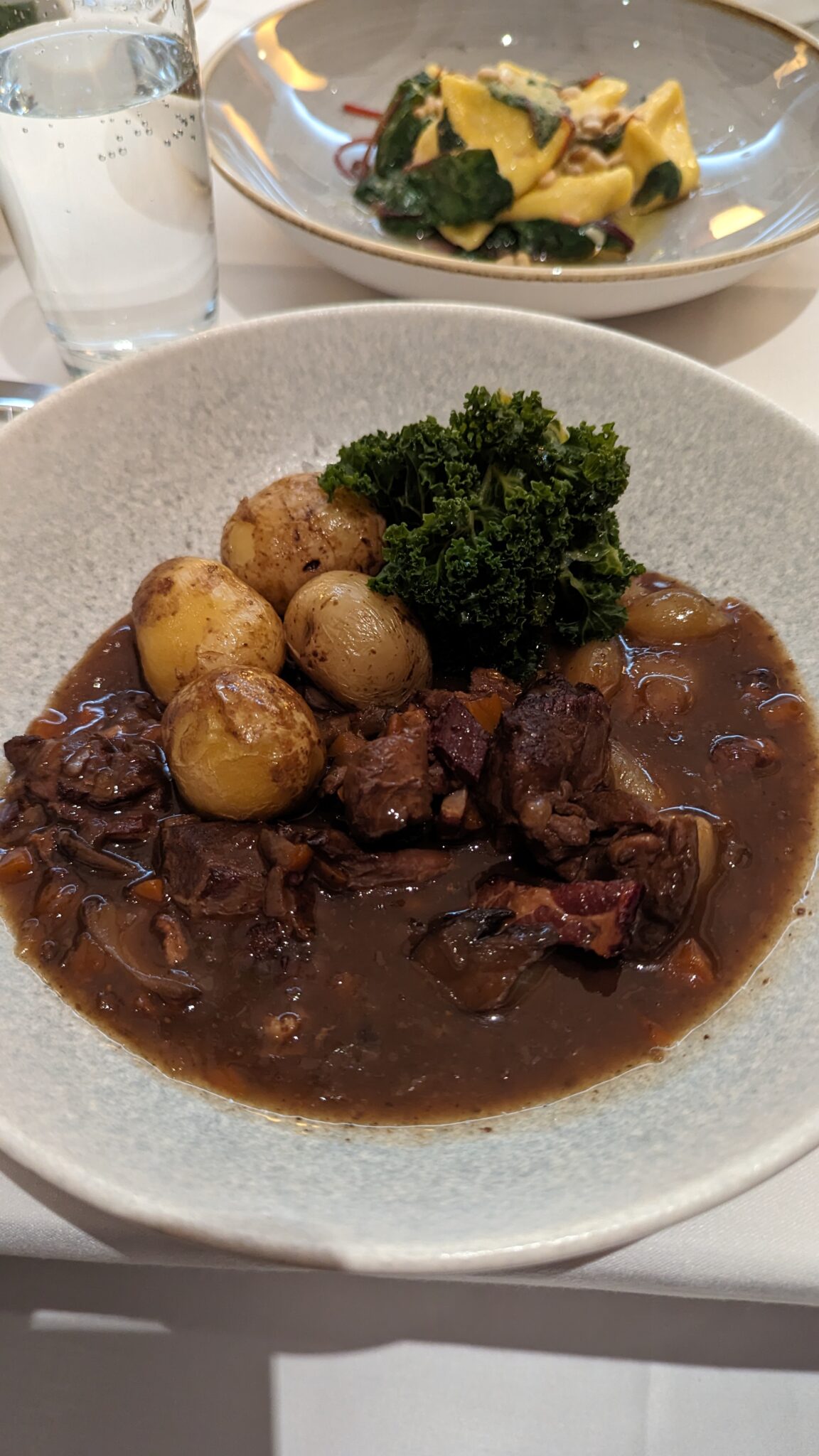 a plate of food with meat and potatoes