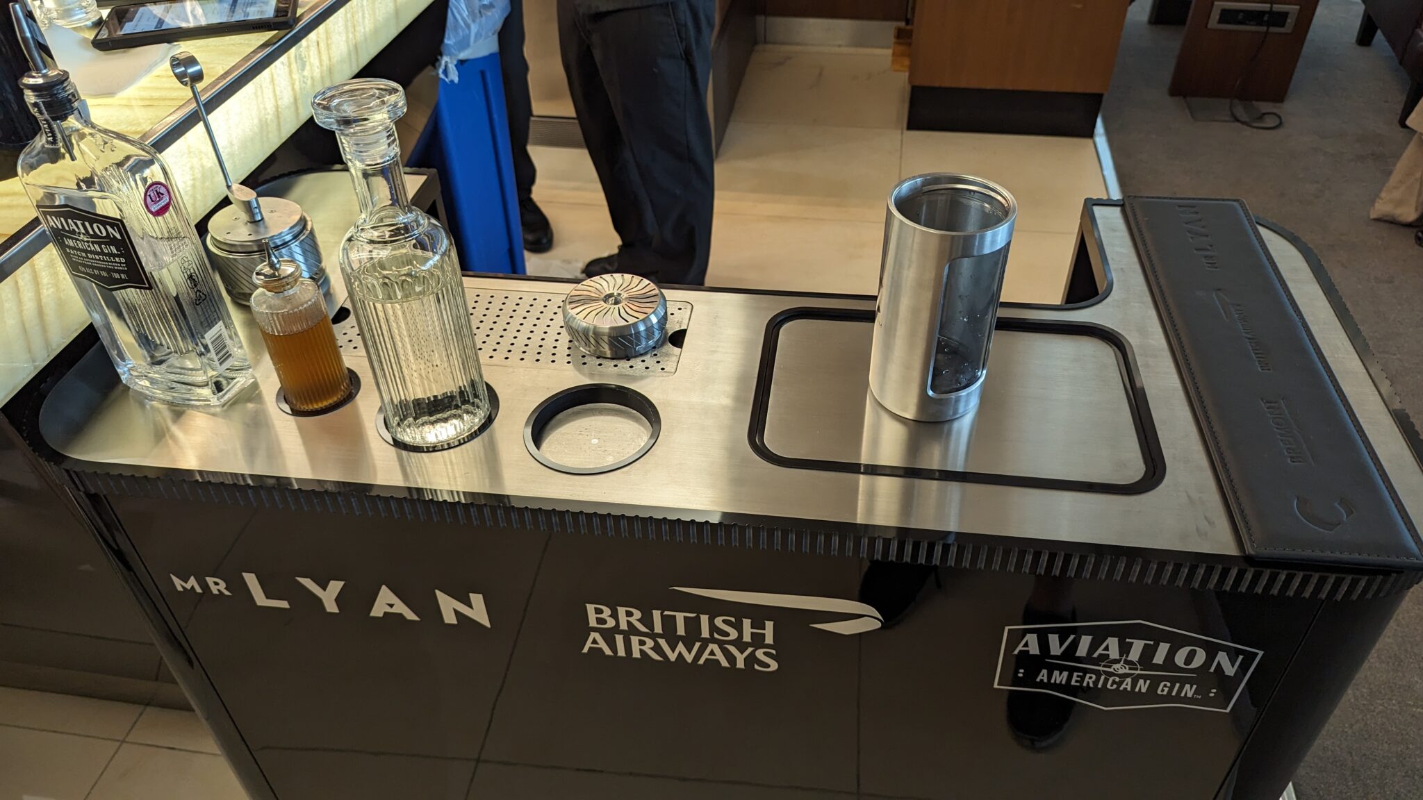 a bar with bottles and glasses on it