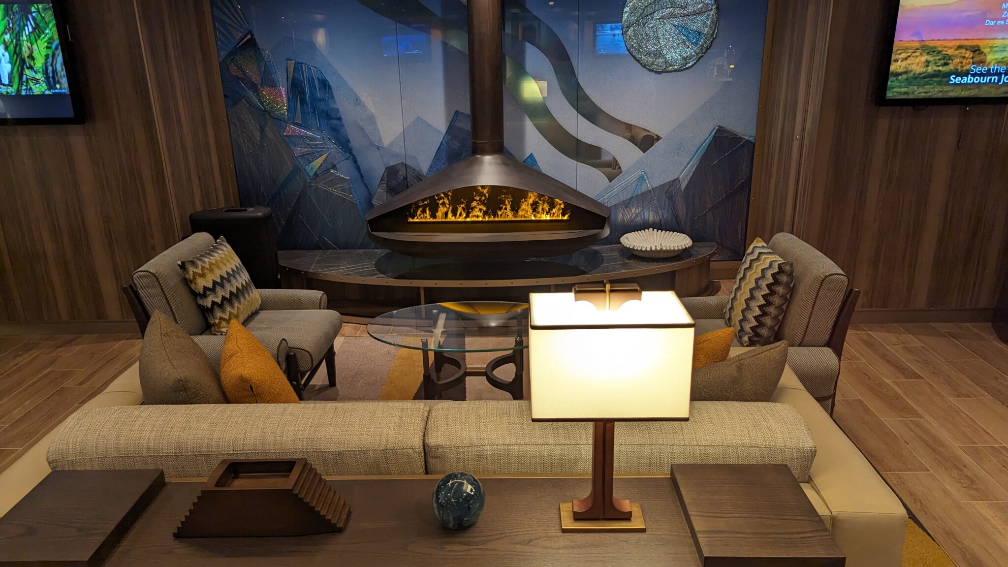 a room with a fireplace and couches