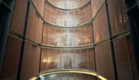 a tall building with glass walls