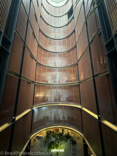 a tall building with glass walls