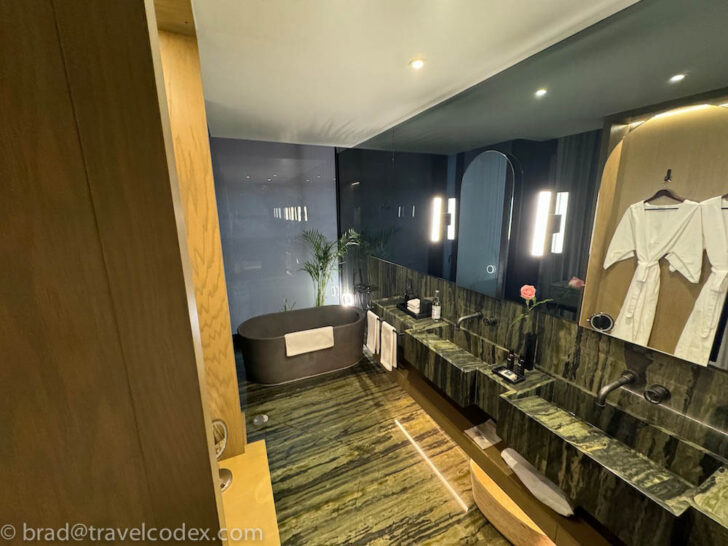 a bathroom with a tub and sink