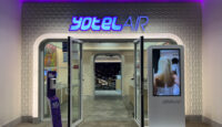 a building with a sign and a screen