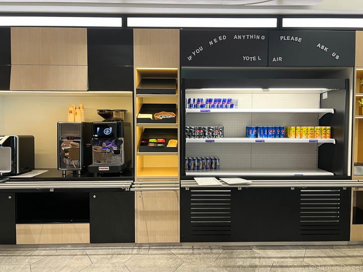 a coffee machine and shelves in a store