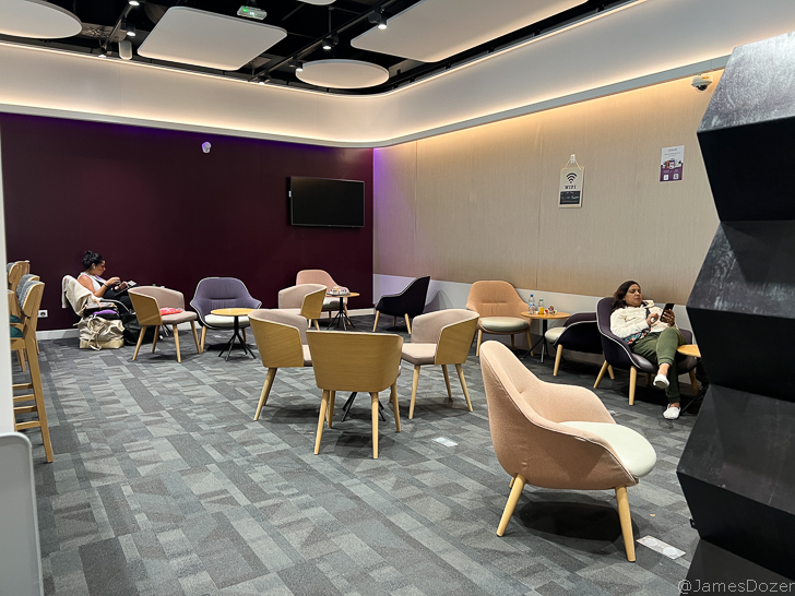 a group of people sitting in chairs in a room