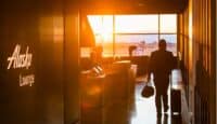 a man carrying luggage in an airport