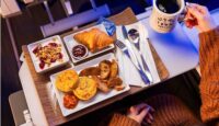 a tray of food and a cup of coffee