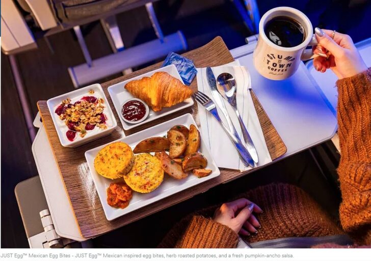 a tray of food and a cup of coffee