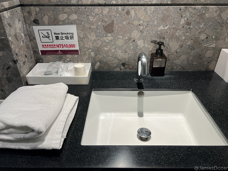 a sink and towel on a counter