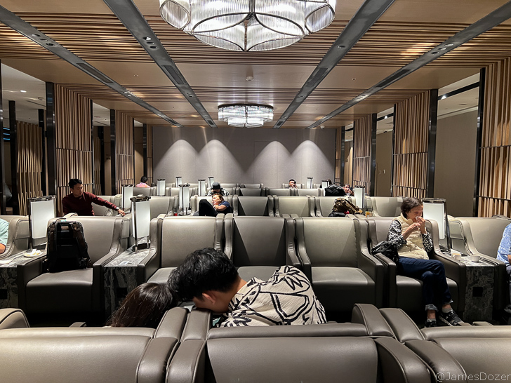 people sitting in a room with a group of people