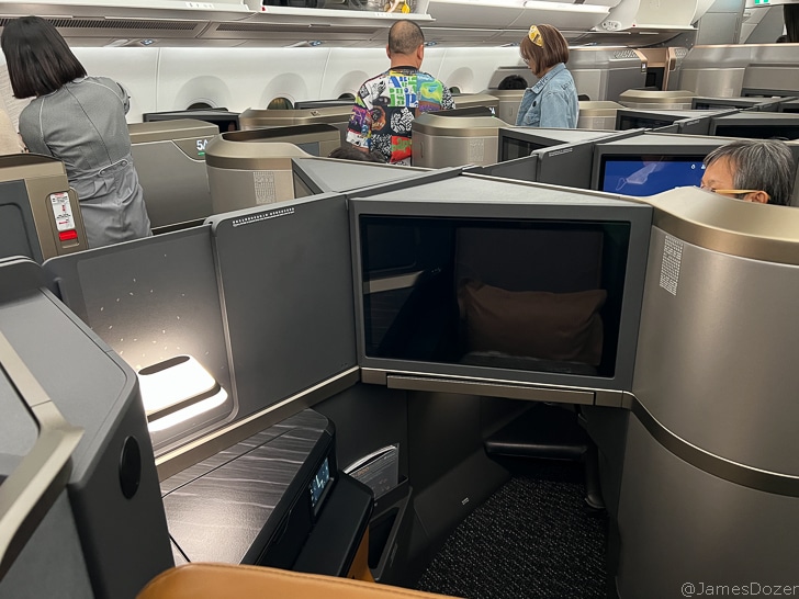 a group of people sitting in an airplane