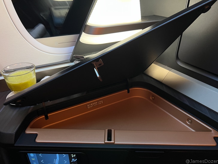 a black box with a glass of juice in the back of it