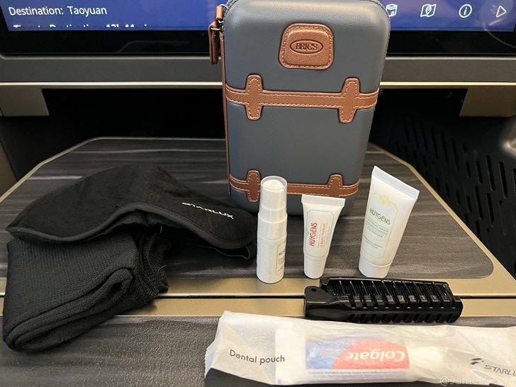 a small bag with a few small items on a table