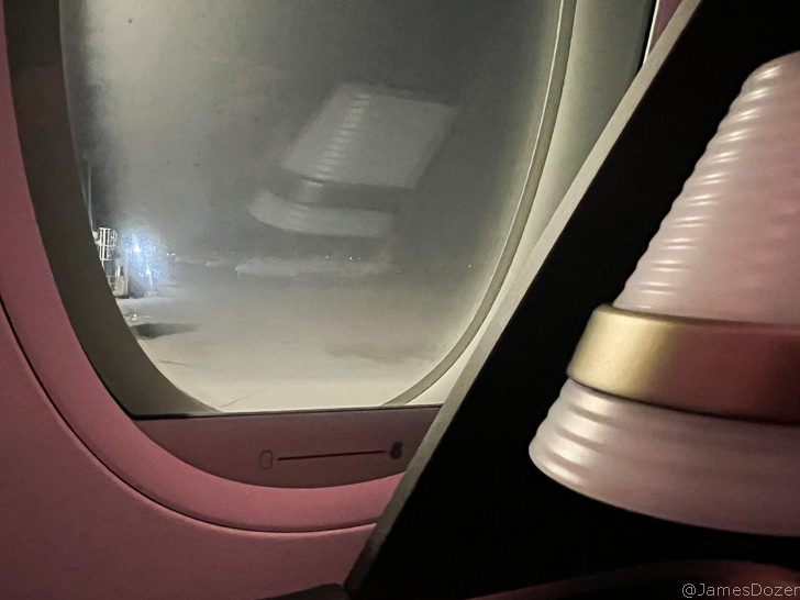 a window with a light in the background
