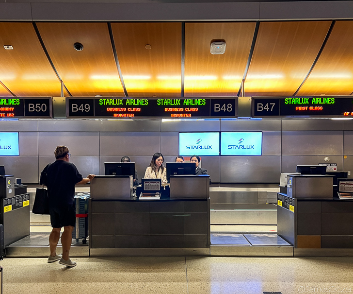 people at a check in counter