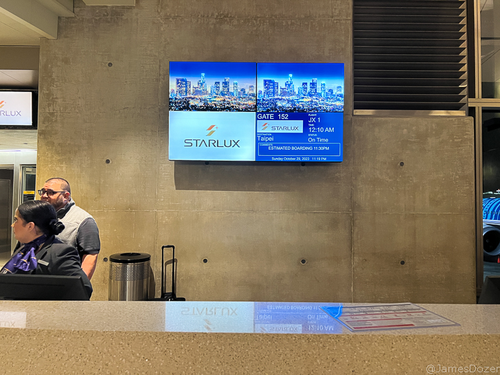 a man sitting in front of a screen