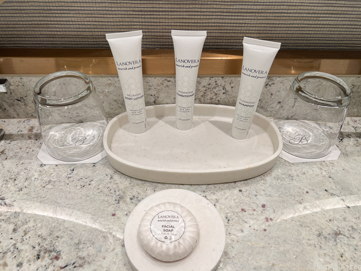 a group of white tubes on a white tray