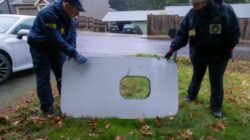 a couple of people holding a rectangular object