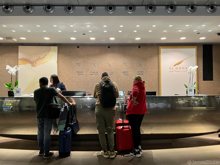 a group of people standing in front of a counter