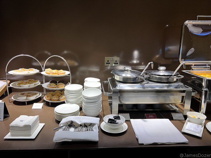 a buffet table with plates and food on it