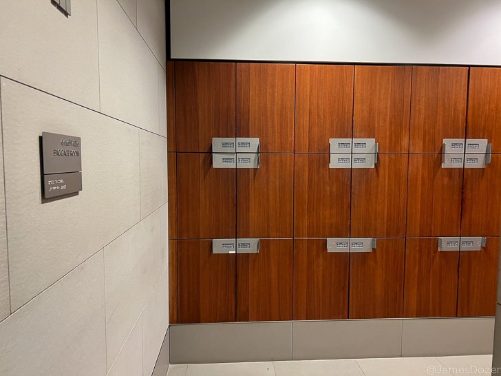 a wooden lockers with silver handles