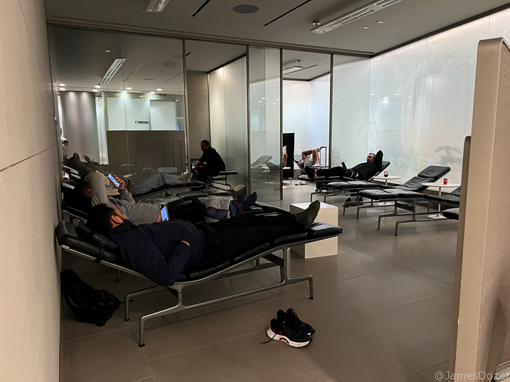 people sitting in chairs in a room