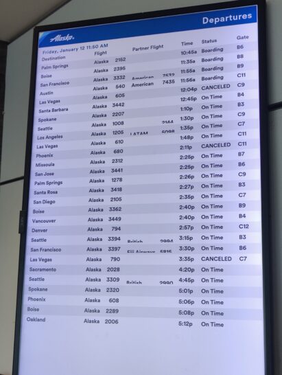 a screen with a flight schedule