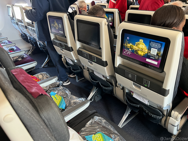 a group of people sitting in an airplane
