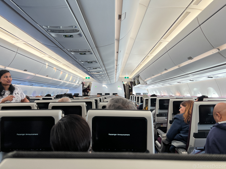 a group of people sitting in an airplane