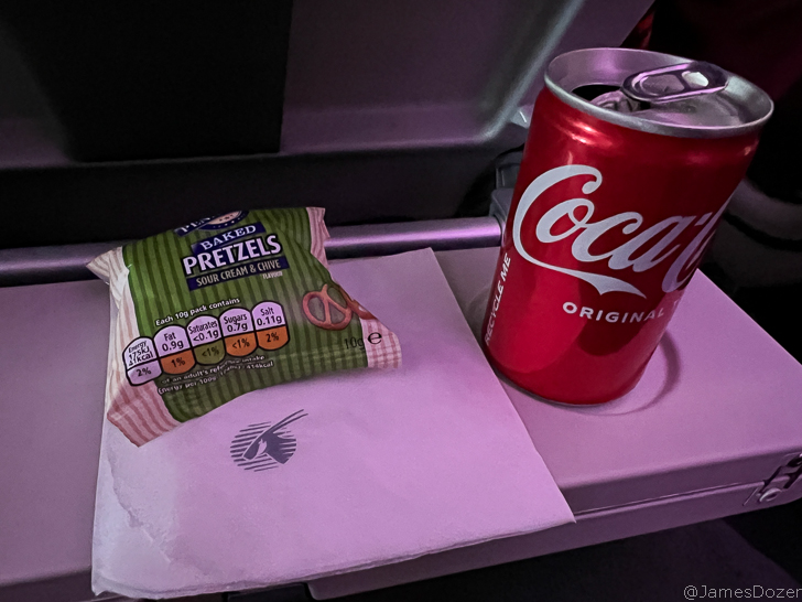 a can and snack on a tray