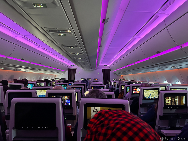 a group of people sitting in an airplane