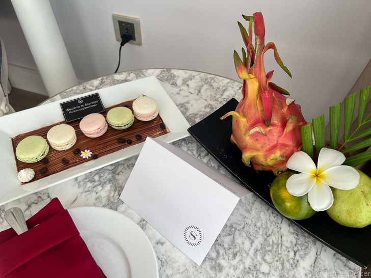 a plate of fruit and a fruit on a table