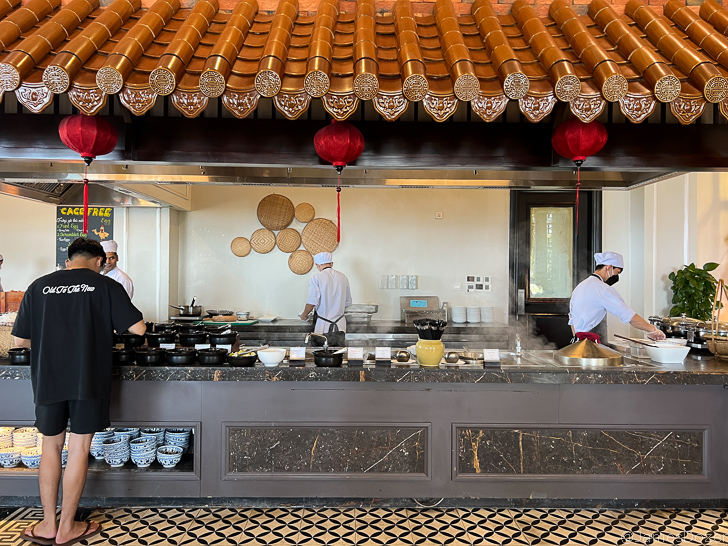 a group of chefs cooking in a kitchen