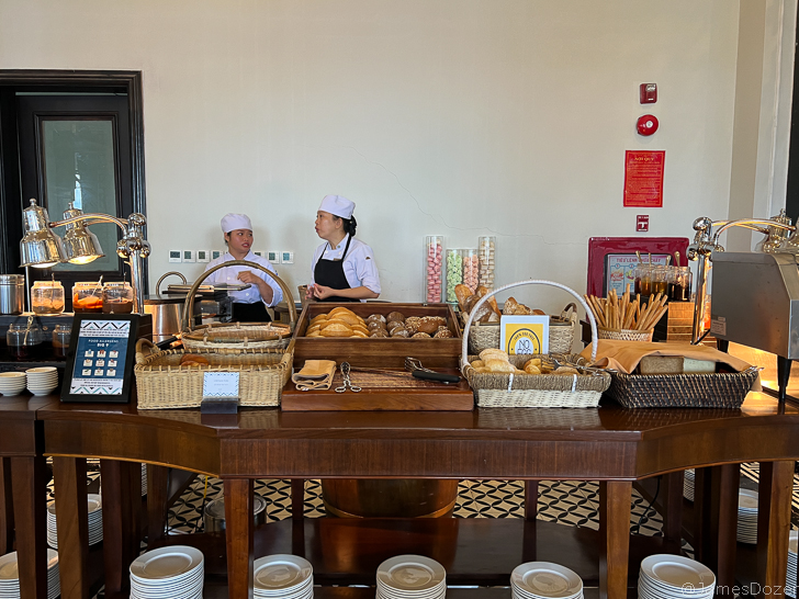 a couple of chefs in a bakery