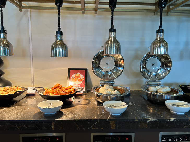 a counter with bowls of food on it