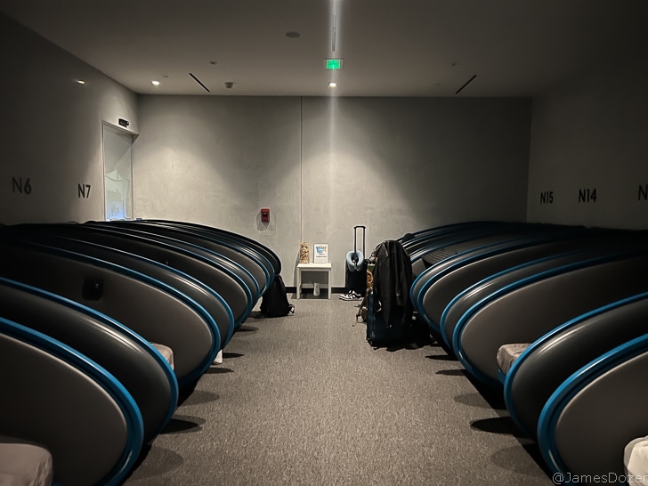 a room with chairs and luggage