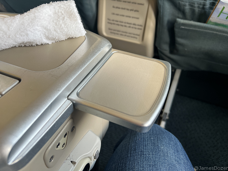 a seat with a towel on the side