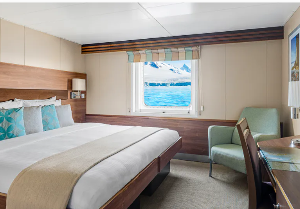 a room with a bed and chair
