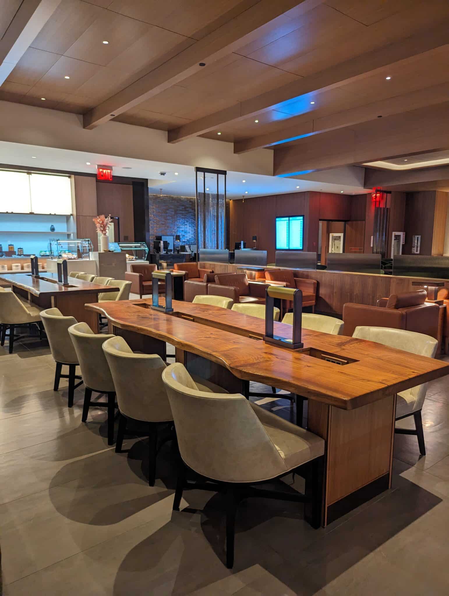 a room with a long table and chairs