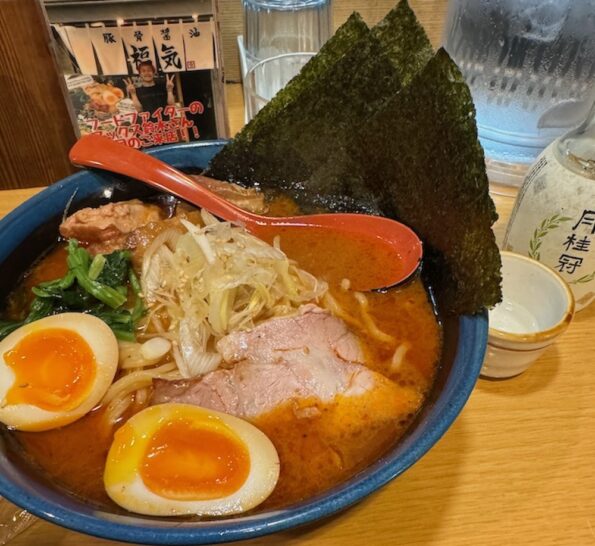 a bowl of ramen soup with eggs and meat