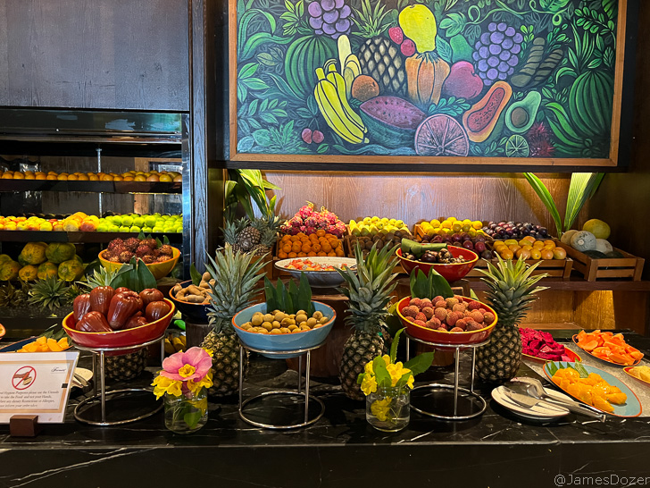 a buffet table with fruit and vegetables