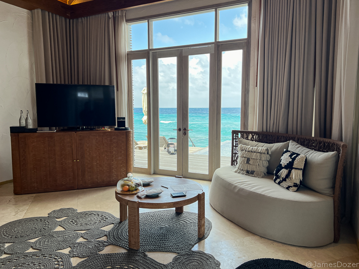 a living room with a large glass door and a couch